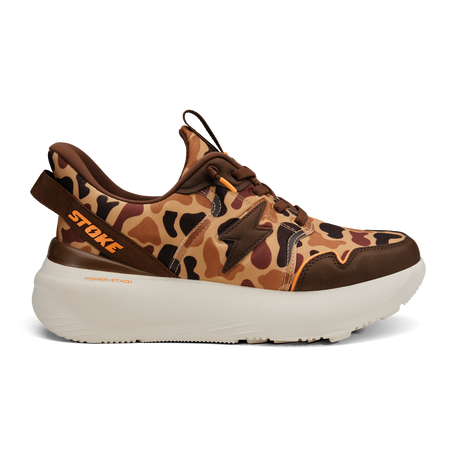 Leopard print sneaker with brown accents on a white background