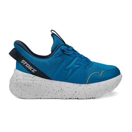 Blue athletic shoe with white sole on a white background