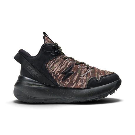A single STOKE sneaker shown in a side profile on a white background. The shoe features a brown and black camouflage pattern on the upper, black synthetic overlays, a black midsole, and a black textured outsole.