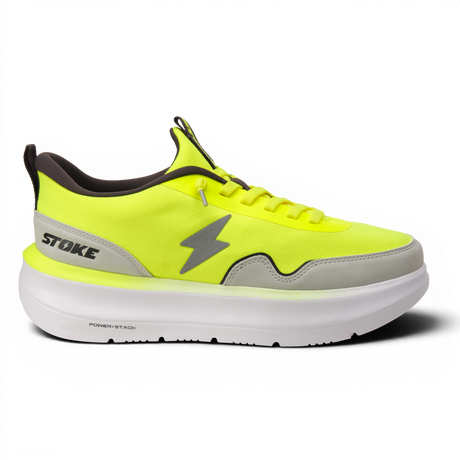Neon yellow athletic shoe with gray accents on a white background