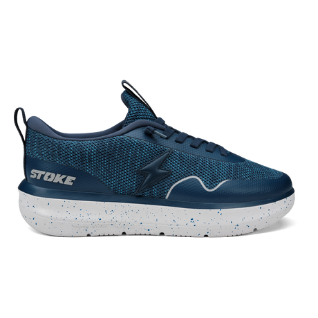 Blue athletic shoe with white sole on a white background